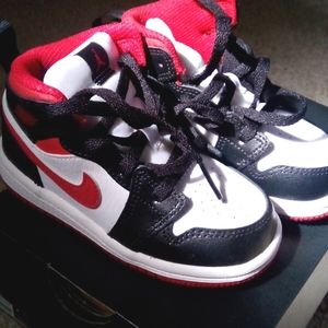 New kids Jordan's, never worn, black, red & white size 7.